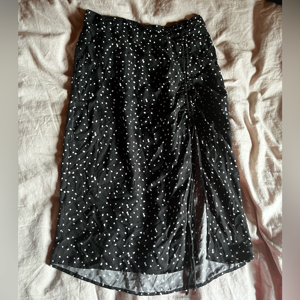 Black and white polka dot slip skirt with slit